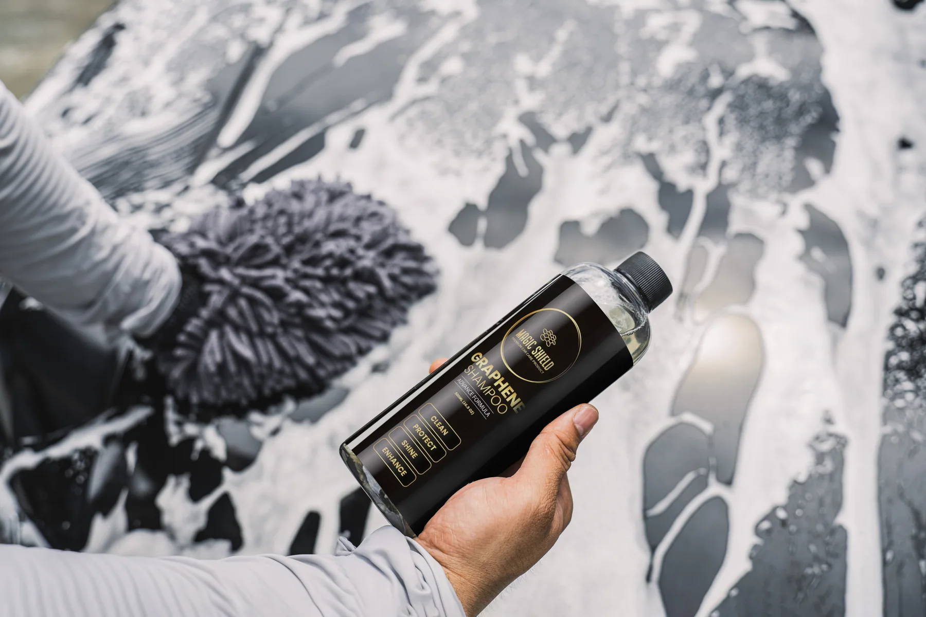 Magic Shield Graphene Shampoo producing rich foam during a car wash