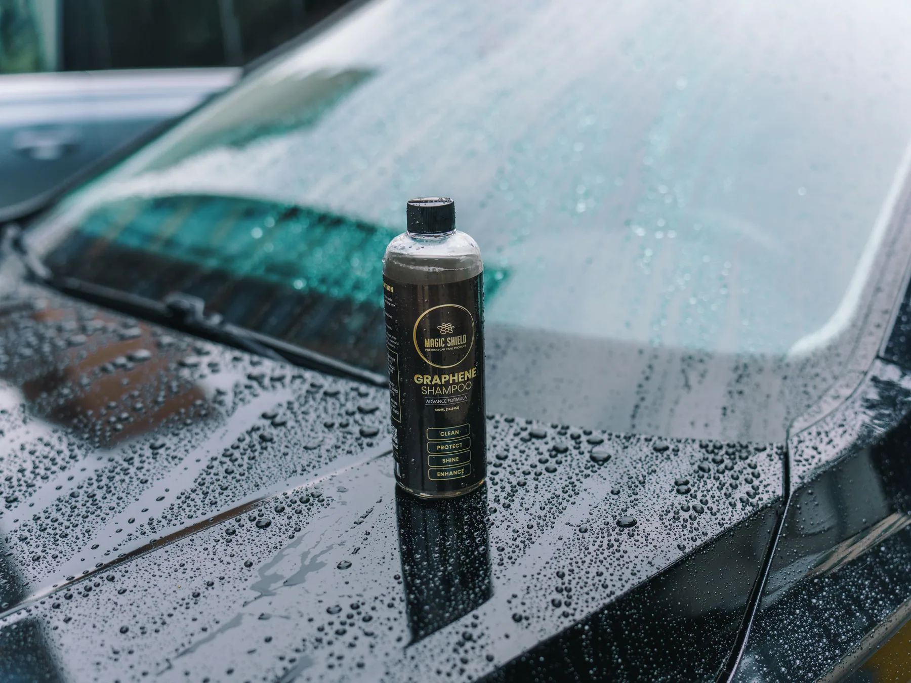 Tight water beads on glossy car paint after washing with Graphene Shampoo